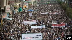 Shiite rebels, known as Houthis, gather during a protest against Saudi-led airstrikes in Sanaa, Yemen, Friday, April 10, 2015. 