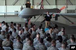 FILE - U. S. Defense Secretary Ash Carter addresses the U.S. troops as he stands in front of a drone at the Incirlik Air Base near Adana, Turkey, Dec. 15, 2015.