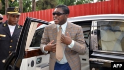 Teodorin Nguema Obiang (R), the son of Equatorial Guinea's president Teodoro Obiang and the country's vice-president in charge of security and defense, arrives at Malabo's Cathdral to celebrate his 41st birthday, June 25, 2013. 