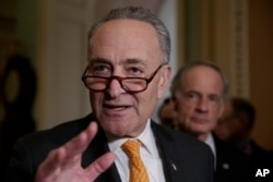 FILE - Senate Minority Leader Charles Schumer, a New York Democrat, speaks with reporters on Capitol Hill in Washington.