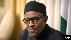 FILE - Nigerian president Muhammadu Buhari gives an interview to Agence France-presse during the 25th African Summit on June 14, 2015 in Johannesburg. 