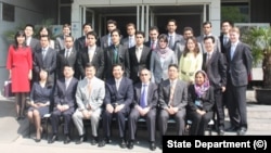 FILE - Participants in a joint program to train Afghan diplomats are seen outside the U.S. embassy in Beijing in this State Department photo. 