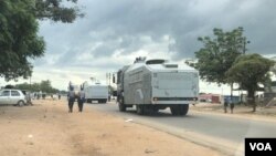 Police monitoring people outside the Chitungwiza Magistrates' Courts on Monday. (Photo: Thomas Chiripasi)