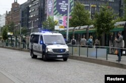 Finnish police patrol the streets in central Helsinki, Finland, Aug. 18, 2017, after stabbings in Turku.