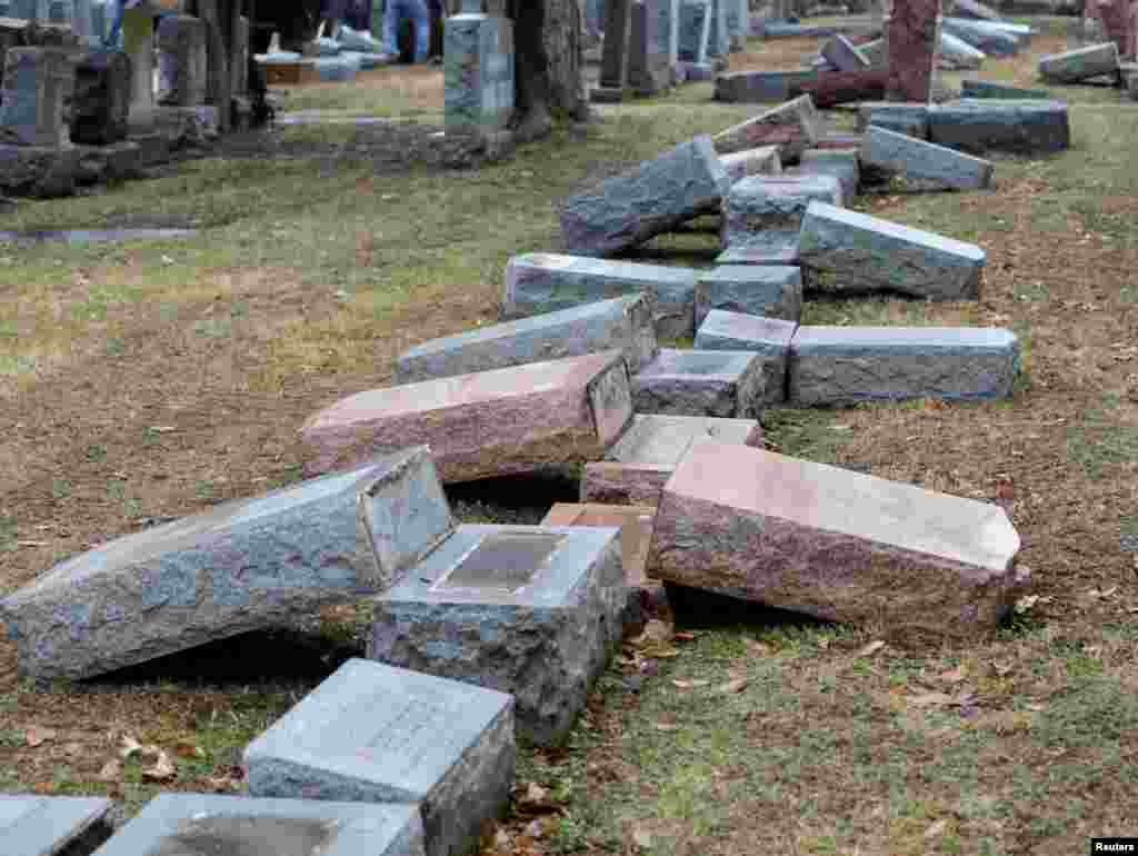 A row of more than 170 toppled Jewish headstones is seen after a weekend vandalism attack at Chesed Shel Emeth Cemetery in University City, a suburb of St. Louis, Missouri, Feb. 21, 2017.