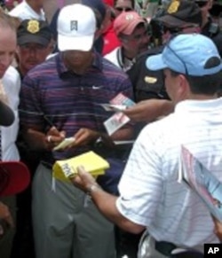 Tiger signing autographs at this year's AT&T Tournament