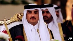 FILE- Qatar's Emir Sheikh Tamim bin Hamad al-Thani attends a Gulf Cooperation Council summit in Doha, Qatar, Dec. 9, 2014.