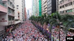 Hong Kong residents rallied against a proposed law that would allow extradition to China on Sunday in one of the largest protests in decades. 