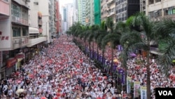  Hong Kong residents rallied against a proposed law that would allow extradition to China on Sunday in one of the largest protests in decades. 