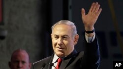 Israeli Prime Minister Benjamin Netanyahu waves during the opening ceremony for a bomb-proof emergency room in a hospital in Ashkelon, Feb. 20, 2018.