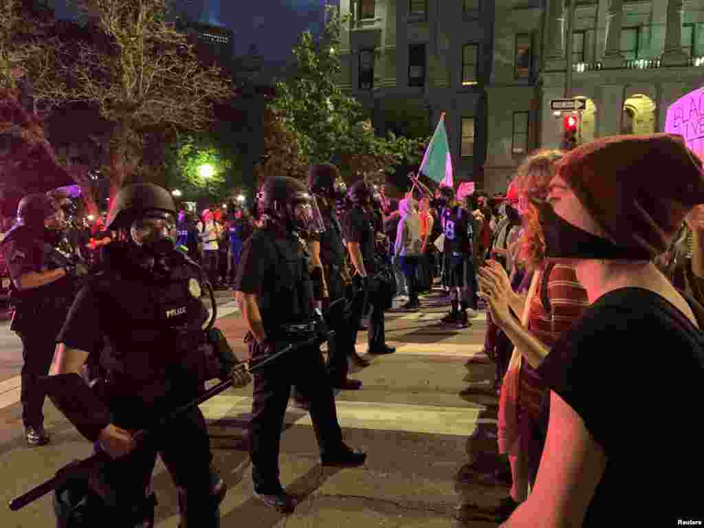 Demonstrators face off with police in riot gear near the Capitol building, to protest Monday's killing of African-American man George Floyd in Minneapolis by a white police officer, in Denver, Colorado, U.S., May 28, 2020 in this image obtained from social media. Picture taken May 28, 2020. Courtesy of Madison Lauterbach/Ms. Mayhem Magazine/@MsMayhem_Mag via REUTERS THIS IMAGE HAS BEEN SUPPLIED BY A THIRD PARTY. MANDATORY CREDIT. NO RESALES. NO ARCHIVES