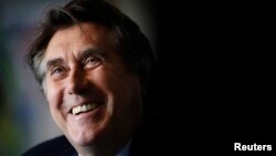 FILE - English singer Bryan Ferry smiles during an interview in Berlin, October 12, 2010. 