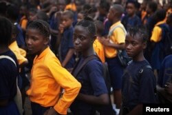 FILE - Students arrive for class at the Every Nation Academy private school in the city of Makeni in Sierra Leone, April 20, 2012. The West African nation's ban on pregnant girls attending schools will be examined by a regional court.