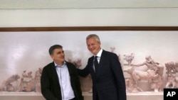 French Minister of the Economy and Finance Bruno Le Maire , right, meets with his Greek Finance Minister Euclid Tsakalotos in Athens, June 12, 2017. Their meetings in Athens are aimed at ending a months-long delay in a rescue funding agreement between Greece and bailout lenders