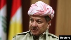 FILE - Kurdish Regional Government President Masoud Barzani speaks during an interview with Reuters in Irbil, in Iraq's Kurdistan region, May 12, 2014. 