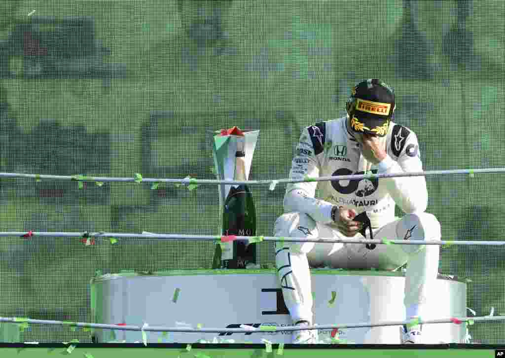 AlfaTauri driver Pierre Gasly of France reacts on the podium after winning the Formula One Grand Prix at the Monza racetrack in Monza, Italy.