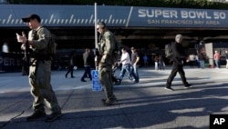 Members of the FBI SWAT team keep watch inside the NFL Experience, Feb. 2, 2016, in San Francisco.