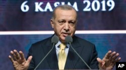 FILE - Turkish President Recep Tayyip Erdogan speaks during a meeting in Ankara, Turkey, Nov. 6, 2019.