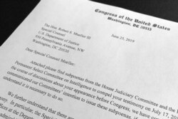 FILE - The letter from House Judiciary Chairman Jerrold Nadler and House Intelligence Committee Chairman Adam Schiff to Robert Mueller that was sent with subpoenas to compel Mueller's testimony July 17, is photographed in Washington, June 25, 2019.