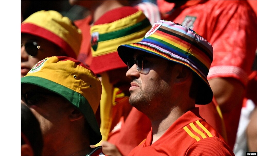 A Wales fan wears a rainbow coloured hat inside the stadium before the match between Wales and Iran on November 25, 2022.