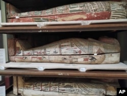 In this undated photo provided by Emma Paolin, a view of a selection of the mummified bodies in the exhibition area of the Egyptian museum in Cairo. (Emma Paolin via AP)