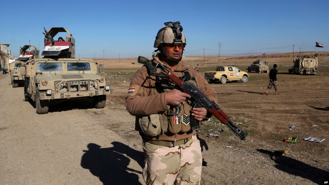 FILE - Iraqi army soldiers deploy after defeating Islamic State militants in the eastern side of Mosul, Iraq, Jan. 24, 2017.