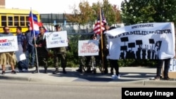 More than 120 protesters gathered in front of the U.S. Immigration and Customs Enforcement Office to petition to allow eight Cambodian American who are facing deportation to stay with their families in Minnesota, Monday, September 26, 2016. (Courtesy of IKARE) 