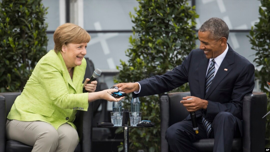 Nemačka kancelarka Angela Merkel i bivši američki predsednik Barak Obama na konferenciji u Berlinu.