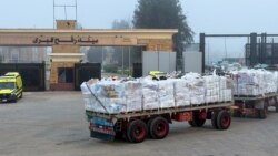 Trucks carrying aid through the Rafah border crossing, on the Egyptian side, in Rafah, Egypt, February 10, 2026.