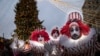 Performers gesture at Holiday&#39;s Market near Red Square, decorated for New Year and Orthodox Christmas celebrations in Moscow, Russia.