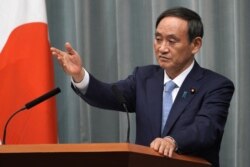 FILE - Yoshihide Suga, Japan's Chief Cabinet Secretary, speaks during a press conference at the prime minister's official residence in Tokyo, Sept. 11, 2019.