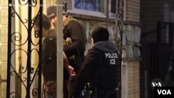 In this video still, authorities are seen seeking 'criminal aliens' in Chicago.