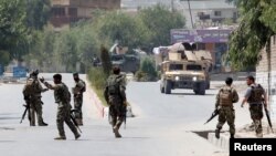 Afghan National Army (ANA) soldiers arrive at the site of gunfire and attack in Jalalabad city, Afghanistan, July 11, 2018. 
