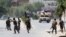 Afghan National Army (ANA) soldiers arrive at the site of gunfire and attack in Jalalabad city, Afghanistan, July 11, 2018. 