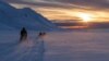 FILE: Para ilmuwan mengendarai mobil salju mereka melintasi Arktik menuju Kongsfjord saat matahari terbenam di dekat Ny-Alesund, Svalbard, Norwegia, 10 April 2023. (Lisi Niesner/REUTERS)