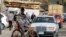 In this March 16, 2013 photo, an Egyptian bread vendor rides his bicycle in downtown Cairo.