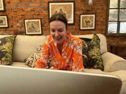 Roxy Danckwerts, founder of Wild is Life, is seen in at a computer, in Harare, Zimbabwe, Sept. 23, 2020. (Columbus Mavhunga/VOA)