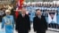 Russia's President Vladimir Putin, right, and Turkey's President Recep Tayyip Erdogan review an honor guard during a welcoming ceremony at the Presidential Palace in Ankara, Dec. 1, 2014. 