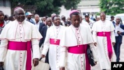 FILE - Archbishop Marcel Utembi, second left, president of the National Episcopal Conference of Congo (CENCO), and other Catholic bishops arrive for the signing of an accord at the interdiocesan center in Kinshasa, Jan. 1, 2017 following talks launched by the Roman Catholic Church between the government and opposition. The bishops have ended their mediation efforts between the Rassemblement and President Joseph Kabila's political alliance. 