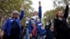 Protesters raise their fists during a demonstration rally organized by women's rights groups to defend the right to abortion, on International Safe Abortion Day in Paris, Sept. 28, 2024. 