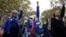 Protesters raise their fists during a demonstration rally organized by women's rights groups to defend the right to abortion, on International Safe Abortion Day in Paris, Sept. 28, 2024. 