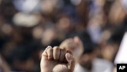 Thousands of mourners shout anti-government slogans during the funeral procession Sept. 16, 2011, in Sitra, Bahrain.