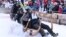Competitors ride their wooden sledge during the traditional Bavarian horn sledge race 'Hornschlittenrennen' in Garmisch-Partenkirchen, Germany, Jan. 6, 2025. 