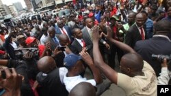 FILE: Zimbabwe top opposition leader Nelson Chamisa, center, arrives to deliver his speech at the party headquarters in Harare, Wednesday, Nov. 20, 2019. 