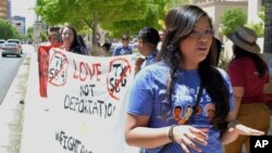 Yazmin Irazoqui Ruiz, 25, of Albuquerque, N.M., speaks at an immigration rally in Albuquerque and about her mixed feelings regarding Cinco de Mayo. President Donald Trump's immigration policies and rhetoric are leaving some Mexican Americans and immigrants feeling at odds with a day they already thought was appropriated by beer and liquor companies, event promoters and local bars.