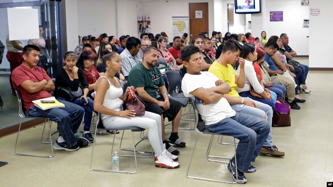 Mexican nationals wait to be seen at the Mexican consulate, March 3, 2017, in Miami.