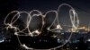 A girl with sparkle writes 2020 during the New Year&#39;s celebrations in North Macedonia.