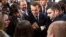 French President Emmanuel Macron, center, speaks with guests next to Minister of the Ecological and Social Transition Nicolas Hulot, left, and French President of the Young Farmers Association Jeremy Decerle, right, after he delivered a speech to the young French farmers invited at the Elysee Palace before the opening of the 2018 Paris International Agricultural Show in Paris, France, Feb. 22, 2018.