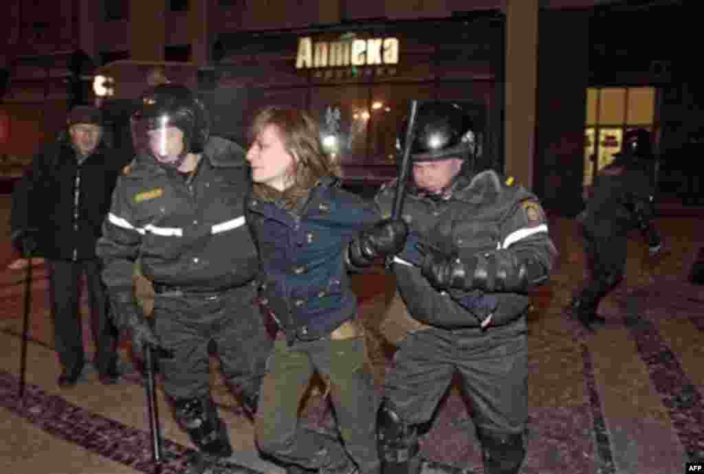 Riot police officers detain a protester during a rally in Minsk, Berlarus, Monday, Dec. 20, 2010. Thousands of opposition supporters in Belarus tried to storm the main government building to protest what the opposition claims was large-scale vote-rigging 