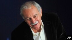 FILE - Spanish novelist Eduardo Mendoza poses for the media in Barcelona, Oct. 16, 2010.